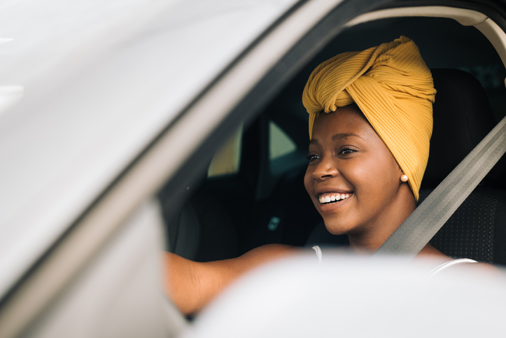 Young woman driving a car