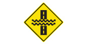 Water covering the road safety sign