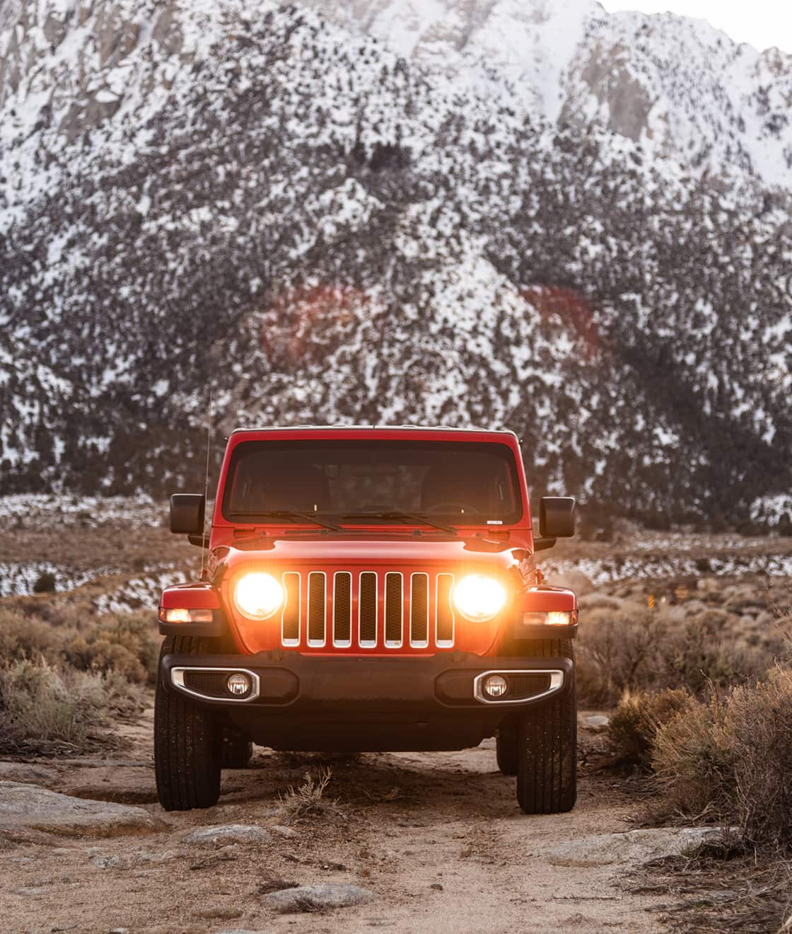 Red Jeep at the foot of the Rocky Mountains